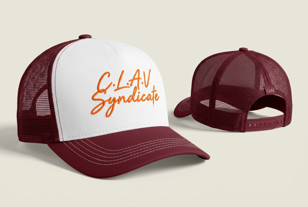C.L.A.V SYNDICATE trucker cap with orange script, white front and wine-red mesh sides